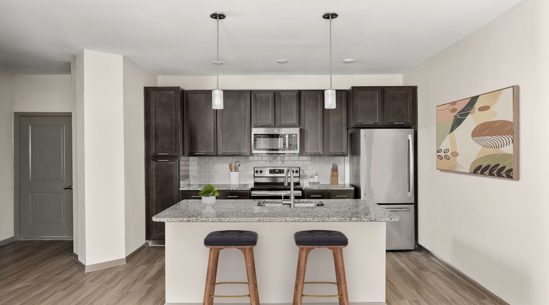 kitchen with an island and bar stools