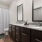 bathroom with two large mirror and sinks