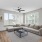 living room with couch and coffee table and large windows
