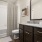 bathroom with a shower, sink,mirror and toilet