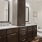 a bathroom with two mirror and sinks next to a toilet