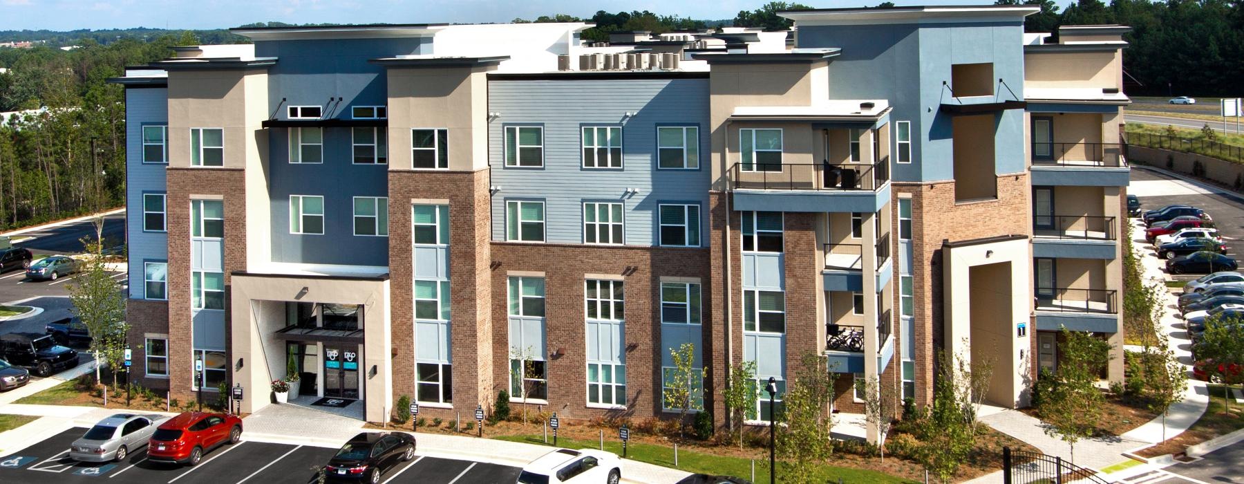 a building with cars parked in front