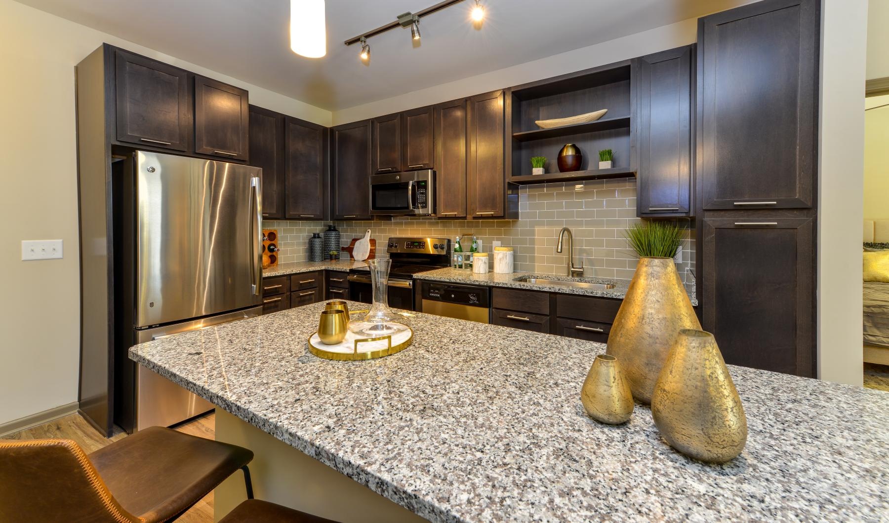 a kitchen with black cabinets